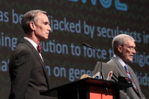 Creation Museum head Ken Ham, right, speaks during a debate on evolution with TV's 