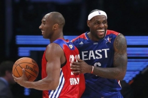 Lakers guard Kobe Bryant (l.) of the West and LeBron James of the East share a laugh. (LUCY NICHOLSON/REUTERS) <br/>
