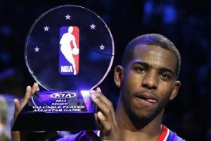 NBA All-Star Chris Paul of the Los Angeles Clippers holds up the MVP trophy after the 2013 NBA All-Star basketball game in Houston, Texas, February 17, 2013. CREDIT: REUTERS/LUCY NICHOLSON <br/>