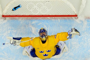 Sweden goalie Henrik Lundqvist celebrates after defeating Finland in the men's hockey semifinals. (Photo: Scott Rovak, USA TODAY Sports) <br/>