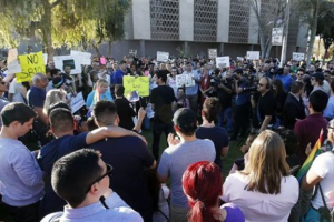 Nearly 250 gay rights supporters protest SB1062 at the Arizona Capitol, Friday, Feb. 21, 2014, in Phoenix. The protesters gathered demanding Gov. Jan Brewer veto legislation that would allow business owners to refuse to serve gays by citing their religious beliefs. (Photo: AP) <br/>
