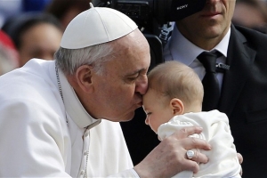 Pope kissing a baby.  <br/>