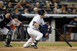 New York Yankees' Jacoby Ellsbury, right, hits a fifth-inning RBI-double in a baseball game against the Boston Red Sox at Yankee Stadium in New York, Thursday, April 10, 2014 <br/>