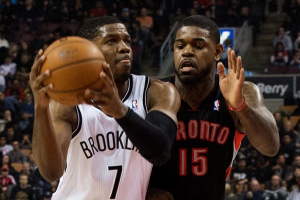Jan 11, 2014; Toronto, Ontario, CAN; Brooklyn Nets shooting guard Joe Johnson (7) takes the ball to the basket as Toronto Raptors power forward Amir Johnson (15) tries to defend during a game at the Air Canada Centre. (Photo)Nick Turchiaro-USA TODAY Sports <br/>