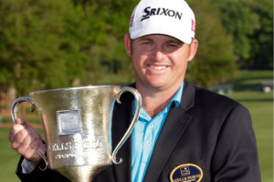 J.B. Holmes poses with the trophy after winning the Wells Fargo Championship golf tournament in Charlotte, N.C., Sunday, May 4, 2014. (AP Photo/Bob Leverone) <br/>