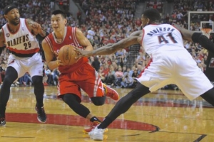 Houston Rockets' Jeremy Lin (7) drives against Portland Trail Blazers' Thomas Robinson (41) and Mo Williams (25) during game six Friday night.   <br/>AP