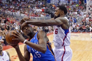 Los Angeles Clippers center DeAndre Jordan, right, smacks Oklahoma City Thunder forward Kevin Durant on the head as he goes up for a shot in the first half of Game 4 of the Western Conference semifinal NBA basketball playoff series, Sunday, May 11, 2014, in Los Angeles. <br/>