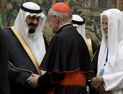 King Abdullah of Saudi Arabia, left, shakes hands with a catholic bishop as Abdullah Ibn Abdul, secretary general of the Muslim World League, right, looks on at the World Conference on Dialogue at the Pardo Palace in Madrid, Wednesday, July 16, 2008. King Abdullah of Saudi Arabia exhorted followers of the world's leading faiths to turn away from extremism and embrace a spirit of reconciliation, saying at the start of an interfaith conference Wednesday that history's great conflicts were not caused by religion itself but by its misinterpretation. <br/>(Photo: AP/Victor R. Caivano)