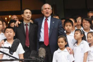 Accompanied by Pastor Jian-An, President Bush makes remarks after attending church at the Beijing Kuanjie Protestant Christian Church during his visit to the 2008 Summer Olympic games in Beijing, China Sunday, Aug. 10, 2008. <br/>(AP Photo/Gerald Herbert)