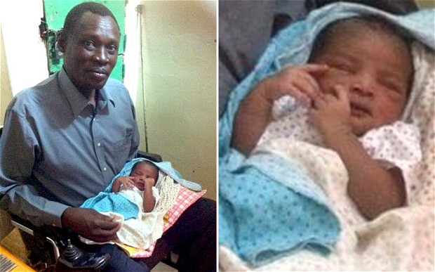 Daniel Wani Holds His Newborn Baby