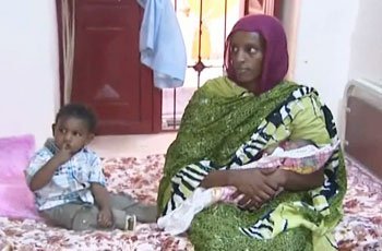 Sudanese Christian Woman and her newborn child