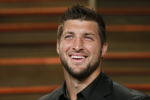 Former NFL player Tim Tebow arrives at the 2014 Vanity Fair Oscars Party in West Hollywood, California March 2, 2014. REUTERS/Danny Moloshok  <br/>