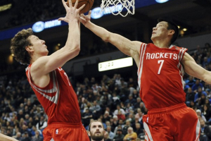 Houston Rockets' Omer Asik, left,and Jeremy Lin, right, reach for the rebound as Minnesota Timberwolves' Kevin Love, center, watches in the first half of an NBA basketball game, Wednesday, Dec. 26, 2012, in Minneapolis. All three players may be wearing a different uniform next year.  <br/>AP