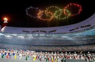 Fireworks in the shape of the Olympic rings are shown over National Stadium during the closing ceremony of the Beijing 2008 Olympics in Beijing, Sunday, Aug. 24, 2008. <br/>(Photo: AP Images / Darron Cummings)