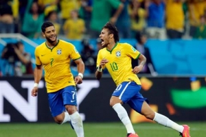 Brazil's Neymar, right, celebrates with teammate Hulk after scoring during the group A World Cup soccer match against Croatia.  Both players have had injury issues so far this World Cup. <br />
 <br/>AP