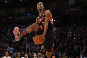 Terrence Ross dunks over a young man during the 2013 dunk contest. <br/>USAToday