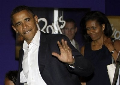 Democratic presidential candidate Sen. Barack Obama, D-Ill. and his wife Michelle Obama, leave a restaurant in Chicago, Friday, Aug. 22, 2008, after dinner. <br/>(Photo: AP Images / Alex Brandon)