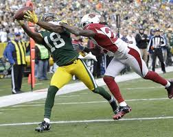 Randall Cobb catches a pass against the Arizona Cardinals in 2013. <br/>Packers News