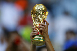 A fan holds up a trophy before the 2014 World Cup Group D soccer match between England and Italy at the Amazonia arena in Manaus on June 14, 2014. (Ivan Alvarado—Reuters) <br/>