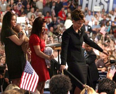 In this Aug. 29, 2008 file photo, Alaska Gov. Sarah Palin comes off the stage to greet the crowd after appearing with Republican presidential candidate, Sen. John McCain, R-Ariz., not in photo, during the 'Road to the Convention Rally,' in Dayton, Ohio. With her are her children Bristol, left, holding Trig, and Willow, center. John McCain's running mate Sarah Palin said Monday that her 17-year-old unmarried daughter, Bristol, is five months pregnant, an announcement aimed at rebutting Internet rumors that Palin's youngest son, born in April, was actually her daughter's. <br/>(Photo: AP Images / Mary Altaffer, File)