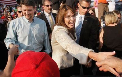 Republican vice presidential candidate, Alaska Gov., Sarah Palin, right, and her husband Todd shake hands with supporters at the conclusion of a campaign unity rally in O'Fallon, Mo., Sunday Aug. 31, 2008. <br/>(Photo: AP Images / Stephan Savoia)