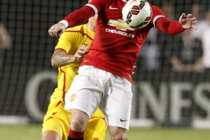 Wayne Rooney controls the ball vs Liverpool in the Guinness International Champions Cup Final Monday.  <br/>AP