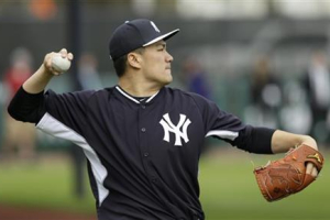 Masahiro Tanaka threw for the first time in about a month on Monday. <br/>AP