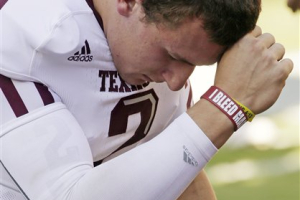 Manziel prays before the 2012 match up with Alabama.   <br/>AP