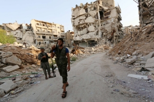 As the United States begins mobilizing for possible military action in Syria, rebels on Tuesday were in a war-torn area of Aleppo. (Getty Images) <br/>