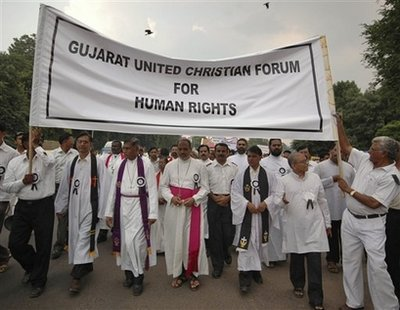 Christians participate in a rally organized by Gujarat United Christian Forum for Human Rights to oppose attacks on Christians in Orissa, in Ahmadabad, India, Tuesday, Sept. 2, 2008. An Indian archbishop filed a petition in the Supreme Court on Tuesday requesting an impartial probe into recent Hindu-Christian violence in eastern India that has killed at least 11 people, a news report said. The trouble erupted late last month with the killing of a Hindu leader in Orissa, which police blamed on Maoist rebels but Hindu activists blamed on Christian militants. <br/>(Photo: AP/Ajit Solanki)