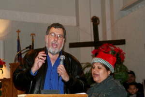 Rev. Dr. Jorge deCasanova, director of Hispanic Ministry at Central Union Mission, speaks at the Hispanic Christmas bag event in Washington, D.C. on Saturday, December 23, 2006. <br/>