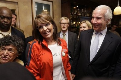 Republican vice presidential candidate Alaska Gov. Sarah Palin, is seen with Ed Snider, chairman of Comcast-Spectacor, at a watch party prior to the first debate between presidential candidates, Republican John McCain and Democrat Barack Obama, at the Irish Pub, a bar in Philadelphia, Friday, Sept. 26, 2008. <br/>(Photo: AP/Matt Rourke)
