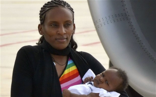 Meriam Ibrahim holds her baby daughter, Maya, who was born in prison <br/>AP photo