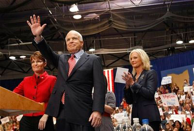 Republican presidential candidate, Sen. John McCain, R-Ariz., and vice presidential candidate, Alaska Gov. Sarah Palin, arrive at a rally in Columbus, Ohio, Monday, Sept. 29, 2008. At right, McCain's wife Cindy McCain. <br/>(Photo: AP Images / Gerald Herbert)