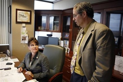 Alaska Gov. Sarah Palin, right, talks with her communications director Bill McAllister, Aug. 14, 2008, in the governor's office in Anchorage, Alaska. <br/>(Photo: AP/Al Grillo)
