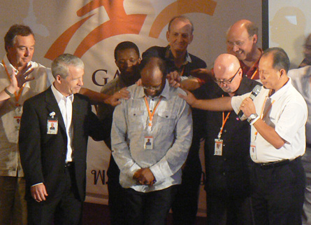 Evangelical leaders at the World Evangelical Alliance General Assembly pray for Joel Edwards, the former general director of the Evangelical Alliance UK and new international director of Micah Challenge, Pattaya, Thailand, Sunday, October 26, 2008. <br/>(Photo: WEA)