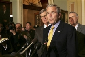 President Bush, center, accompanied by Sen. Jon Kyl, R-Ariz., right, and Senate Minority Whip Trent Lott of Miss., left, make remarks to the press on Capitol Hill in Washington, Tuesday, June 12, 2007, after a luncheon with Republican lawmakers. <br/>