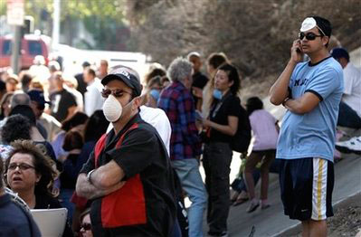 Residents wait outside the Oakridge Mobile Home Park in the Sylmar area of Los Angeles, Calif. on Sunday, Nov. 16, 2008. Several hundred homes at the Mobile Home Park were destroyed by a wildfire that raged through the community. <br/>(Photo: AP Images / Matt Sayles)