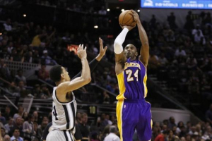 Dec 12, 2014; San Antonio, TX, USA; Los Angeles Lakers shooting guard Kobe Bryant (24) shoots the ball as San Antonio Spurs shooting guard Danny Green (14). Photo: Reuters <br/>