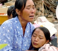 In this photo released by China's Xinhua News Agency, earthquake victims Pu Shanshan, right, and her aunt cry at Kun'e Village in Ning'er County, in southwest China's Yunnan Province, Tuesday, June 5, 2007. A magnitude 6.4 quake struck the area on Sunday, killing three and injuring at least 300. <br/>(AP Photo/Xinhua, Qin Qing) 