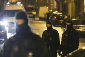 Belgian police during anti-terror raids conducted near Brussels today. Photo: Olivier Hoslet, EPA <br/>