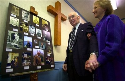 In this Feb. 4, 2004, file photo, Rev. George M. Docherty and his wife, Sue, look at a display of photos celebrating the retired minister's life, at Huntingdon Presbyterian Church in Huntingdon, Pa. Docherty, whose sermon before President Dwight Eisenhower helped push Congress to insert the words 'under God' into the Pledge of Allegiance, has died. He was 97. <br/>(Photo: AP Images / Gene J. Puskar, File)