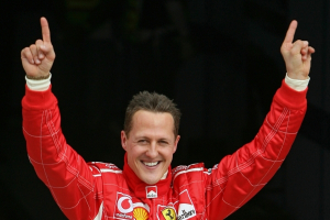 Michael Schumacher waved to the crowd in celebration after taking the pole position at the end of the qualifying session for the Bahrain Formula One Grand Prix at Sakhir racetrack in Manama (March 2006). Reuters <br/>