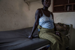 A pregnant woman awaits treatment at Gondama Referral Centre, in southern Sierra Leone, on March 7, 2014. Photo: Lam Yik Fei/Getty <br/>