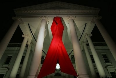 A red ribbon symbolizing AIDS awareness is displayed at the North Portico of the White House, Sunday, Nov. 30, 2008, in Washington to help bring attention to World AIDS Day which is recognized on Monday, Dec. 1. <br/>(Photo: AP/Haraz N. Ghanbari)