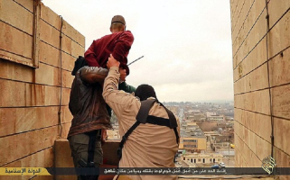 In the video released by ISIS, the man is pushed off a tower block to his death by two masked miltants. <br/>