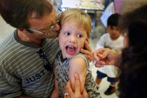 An incoming kindergarten student gets his measles, mumps and rubella shot in this file photo. (David McNew / Getty Images) <br/>
