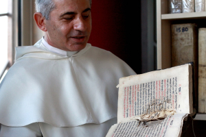 Father Najeeb Michaeel, a Iraqi Dominican monk, has been trying to further preserve Iraq's Christian texts by digitizing the ones he has been able to save. Alice Fordham/NPR <br/>