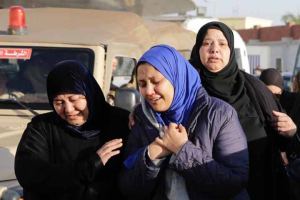 The family of an 18-year-old Egyptian Christian woman who is believed to have been kidnapped by a Muslim radical have criticized police for failing to take action against an alleged suspect who has admitted involvement. Photo shows family members of security forces killed in Sinai on Thursday cry after they received the bodies of their relatives, outside Almaza military airport in Cairo, Egypt, Friday, Jan. 30, 2015. (AP Photo/Hassan Ammar)  <br/>