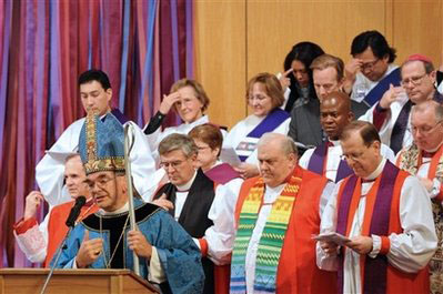 Bishop Robert Duncan, Chairman of the Common Cause Partnership, welcomes attendees to the first worship gathering of the new Anglican Church in North America, held at the Wheaton Evangelical Free Church in Wheaton, Ill., on Dec. 3, 2008. Theological conservatives upset by liberal views of U.S. Episcopalians and Canadian Anglicans formed a rival North American province Wednesday, in a long-developing rift over the Bible that erupted when Episcopalians consecrated the first openly gay bishop. The announcement represents a new challenge to the already splintering, 77-million-member world Anglican fellowship and the authority of its spiritual leader, Archbishop of Canterbury Rowan Williams. <br/>(Photo: AP Images / Kim Johnson - The Anglican Church of North America)